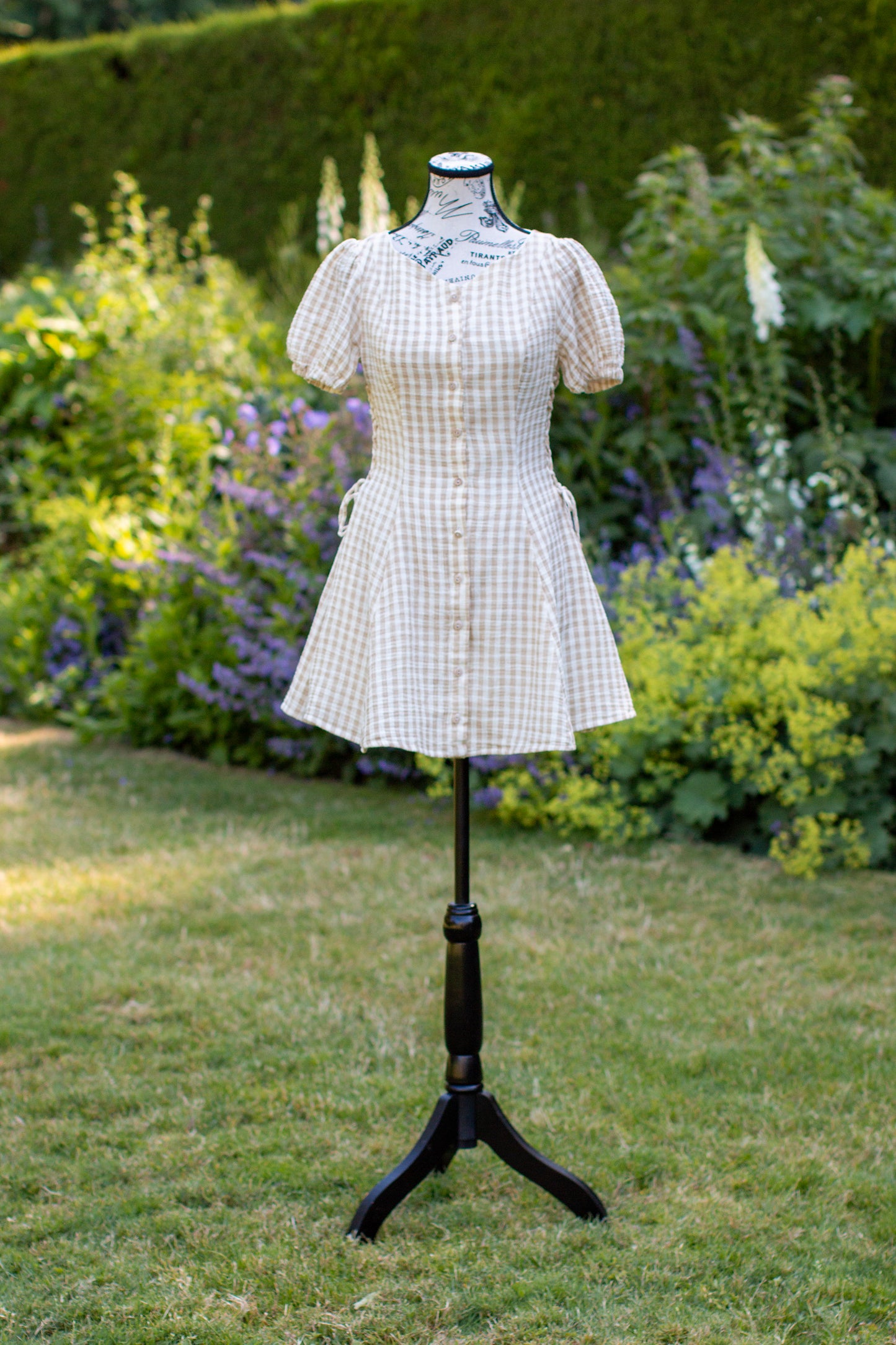 Toasted Crème Custard Dress | Short Sleeve Muslin Mini Dress With Adjustable Side Ties And Wooden Bead Accents