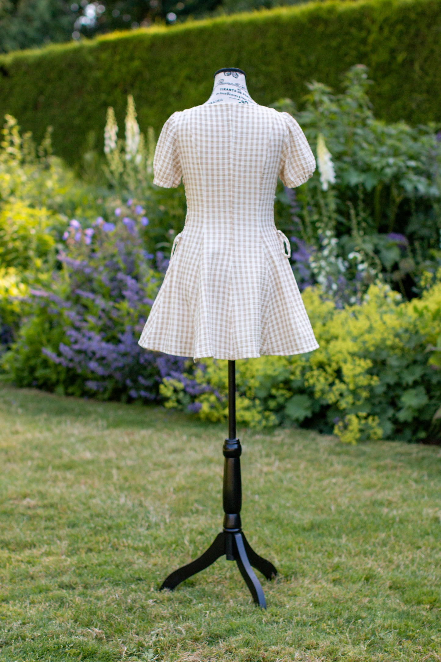 Toasted Crème Custard Dress | Short Sleeve Muslin Mini Dress With Adjustable Side Ties And Wooden Bead Accents
