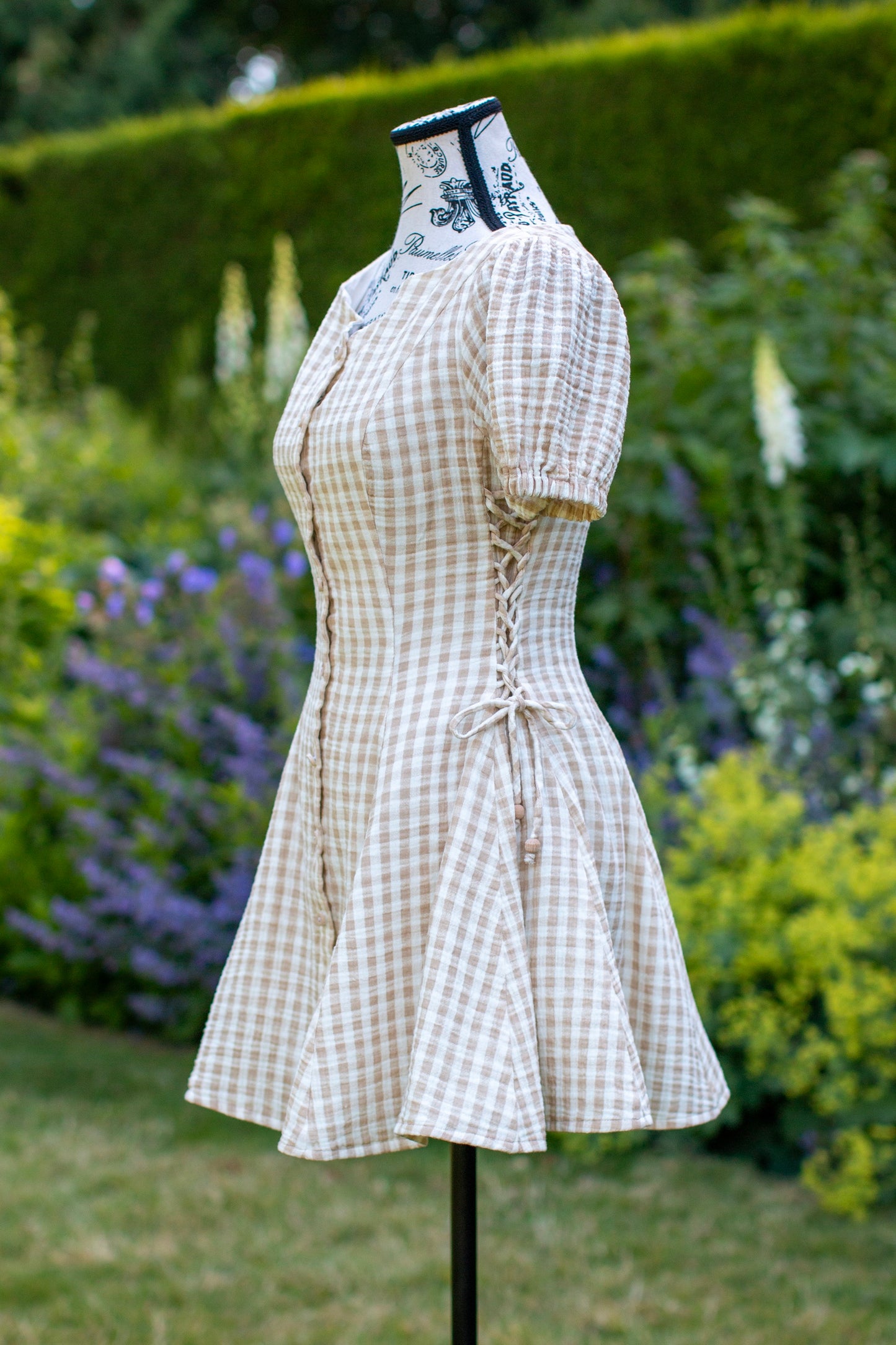 Toasted Crème Custard Dress | Short Sleeve Muslin Mini Dress With Adjustable Side Ties And Wooden Bead Accents