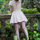 Toasted Crème Custard Dress | Short Sleeve Muslin Mini Dress With Adjustable Side Ties And Wooden Bead Accents