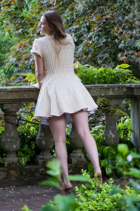 Toasted Crème Custard Dress | Short Sleeve Muslin Mini Dress With Adjustable Side Ties And Wooden Bead Accents